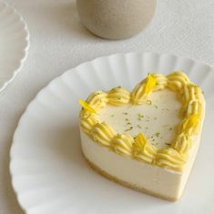 a heart shaped cake sitting on top of a white plate