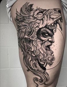 a man's thigh with a lion tattoo on it