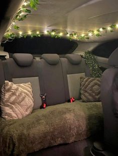 the interior of a car with christmas lights