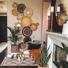 a living room filled with lots of different types of decorations on the wall above a fire place