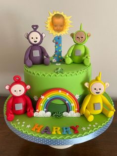 a birthday cake decorated with three little monkeys