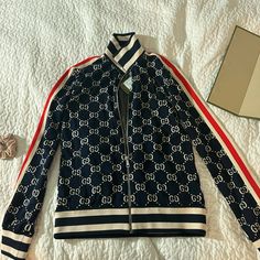 Brand New With Tags Blue Gucci Outerwear For Spring, Gucci Blue Outerwear For Spring, Gucci Blue Spring Outerwear, Blue Gucci Winter Outerwear, Chic Gucci Long Sleeve Outerwear, Chic Long Sleeve Gucci Outerwear, Gucci Long Sleeve Outerwear, Casual Blue Gucci Outerwear, Casual Fitted Gucci Outerwear