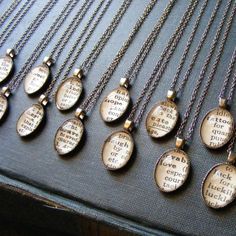 there are many necklaces with words on them