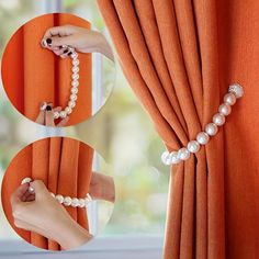 a woman's hand is holding pearls on the curtain