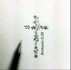 a drawing of a cross with flowers on it