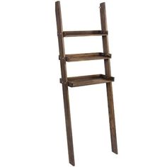 an old wooden ladder leaning against a white wall with shelves on each side and bottom