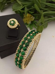 Material:  brass, CZ Stones. Suitable for all kind of outfits like Kurtis lehanga Sarees and Trousers. Arrives in a small plastic box. Highest quality of Craftsmanship. Please let me know if you any questions. Bracelet  1 Ring 1 Bollywood Style Bangle Jewelry As Gift, Traditional Jeweled Bangle For Festive Occasions, Green Bracelets For Ceremonial Festivals, Green Bracelets For Ceremonial And Festival Occasions, Ceremonial Green Bracelets With Tilla Detail, Green Bangle With Intricate Design, Traditional Green Toe Ring Jewelry, Green Bollywood Bangle With Tilla Detail, Green Toe Ring Jewelry For Wedding