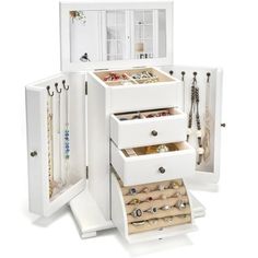 a white jewelry cabinet with several drawers and necklaces in the bottom drawer, open