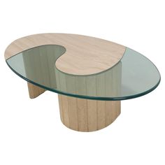 an oval glass and wood coffee table with curved wooden base, on a white background