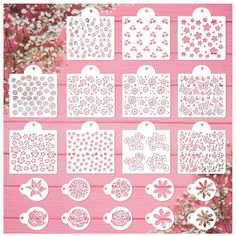 paper cut outs with flowers and hearts on pink wooden background for crafting, scrapping or embellishments