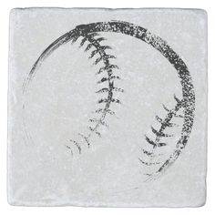 a stone coaster with a baseball drawn on it