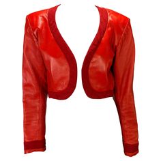 TheRealList presents: a bright red cropped leather Yves Saint Laurent Rive Gauche jacket designed by Yves Saint Laurent. From the Spring/Summer 1990 collection, this fabulous bolero is constructed almost entirely of leather and is made complete with a wide trim around the neck, hem, and cuffs. Follow us on Instagram! @_the_reallist_ Approximate measurements: Size - FR36 36" bust 31" waist 16" shoulder to hem 24" shoulder to cuff 18.5" underarm to cuff 100% leather Leather Bolero, Maroon Leather, Chic Leather, Bolero Jacket, Rive Gauche, Jacket Design, Primavera Estate, Bright Red, Red Leather Jacket