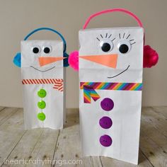 two paper bags made to look like snowmen