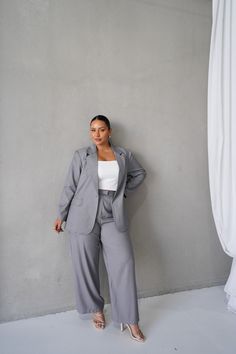 Our Porscha Blazer is re-imagined in this perfectly lightweight fabric, just in time for those warmer days at the office. You can't go wrong with a statement blazer and we think we have perfected that in our Porscha. Take her from the board room to the bar no questions asked - just pop on some cute heels and even a little black mini dress for the perfect night out vibe! Why you'll love this piece: Want to look chic without spending hours trying on outfits before having a total meltdown & cancelling your plans all together? Our Porscha Blazer to the rescue! You simply can't go wrong with a classic blazer, she's a staple piece you will have in your wardrobe for years to come Dress her up or down with almost no effort at all, especially when paired with the matching Downtown pants The details Spring Gray Workwear Suits, Spring Gray Suit For Work, Spring Gray Suits For Workwear, Gray Fall Workwear Suits, Gray Notch Lapel Blazer For Work, Gray Fall Suits For Work, Gray Suits For Fall Workwear, Gray Long Sleeve Suit For Office, Gray Single-breasted Blazer For Work