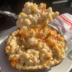 a white plate topped with macaroni and cheese