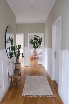 the hallway is clean and ready to be used as a living room or dining area