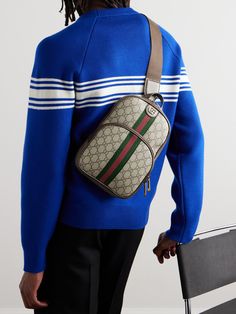 This backpack is monogrammed with Gucci's interlocking G motif and trimmed with signature green and red stripe. The back panel is padded with a comfortable mesh, while the front is fitted with a spacious external zipped pocket. Ideal for daily commutes or short getaways, it can carry a 13-inch laptop, a water bottle and a book. Gucci Collection, Gucci Ophidia, Gucci Accessories, Canvas Backpack, Green And Red, Red Stripe, Mr Porter, Leather Trims, A Book