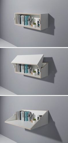 three white shelves with books on them against a gray wall