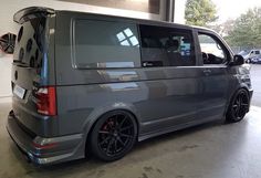 a grey van is parked in a garage