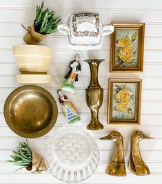 there are many items on the wall to decorate with it's gold and white color