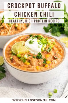 two bowls of crockpot buffalo chicken chili with sour cream and cilantro