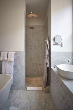 a bathroom with a sink, shower and bathtub