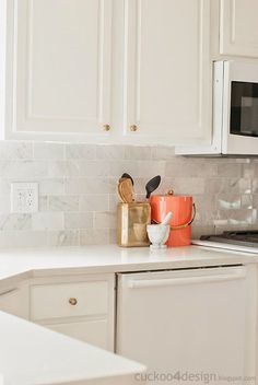 the kitchen counter is clean and ready to be used as a utensil holder