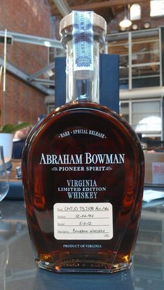 a bottle of abraham bowman whiskey sitting on a table