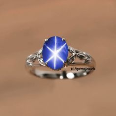 "(Product Details) Main stone - Lindy Star Lab Created Jewelry Type - Ring Gemstone Shape - Oval Shape Material - 925 Sterling Silver Gender - Women And Girl Sizable - Yes Metal Purity - 925 Color - Blue Lindy Star In Sterling Silver 925 Ring with Rhodium Plated.... (Products details In few Words) This ring is a sterling silver 925 Lindy Star ring for women And Girls. STATEMENT RING FOR ALL OCCASION These silver RING make a gorgeous gift for a loved one - for mom, sister, girlfriend, wife or fri Star-shaped Gemstone Rings For Formal Occasions, Star-shaped Silver Sapphire Promise Ring, Star-shaped Sapphire Gemstone Rings, Celestial Style Silver Sapphire Ring For Anniversary, Star-shaped Sapphire Rings For Anniversary, Star Shaped Sapphire Jewelry For Anniversary, Celestial Star Sapphire Ring For Anniversary, Star Shaped Sapphire Ring For Anniversary In Sterling Silver, Blue Star Sapphire Ring