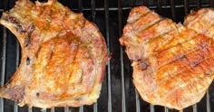 two steaks are cooking on the grill