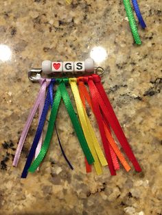 four different colored lanyards with the word i love gps written on one end