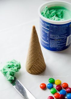 an ice cream cone next to some candy