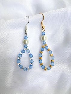 These gorgeous crystal bead  earrings are handmade in Hertfordshire England and are the perfect accessory with any fall outfit.  The earrings will arrive packaged in a beautiful white organza bag, ready for gifting.  These earrings are part of the ourLADYLIKE collection which takes inspiration from different Marian apparitions. These earrings represent Our Ladys blue and white apparition at the French town of Lourdes, where she revealed herself as the Immaculata. Crystal Earrings With Faceted Beads As Gift, Crystal Beaded Earrings With Faceted Beads For Gift, Crystal Beaded Earrings For Gift, Faceted Crystal Beaded Earrings For Gifts, Elegant Blue Crystal Earrings With Faceted Beads, Blue Round Bead Crystal Earrings For Gifts, Blue Crystal Round Bead Earrings For Gift, Blue Round Beads Crystal Earrings For Gift, Crystal Beaded Earrings As Gift