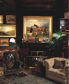 a living room filled with furniture and paintings