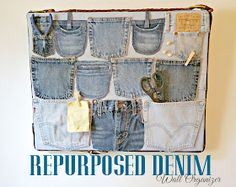 an old pair of jeans hanging on a wall with the words repurposed denim