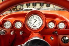 the gauges and dashboard of an old classic car