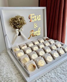 a box filled with cupcakes sitting on top of a table