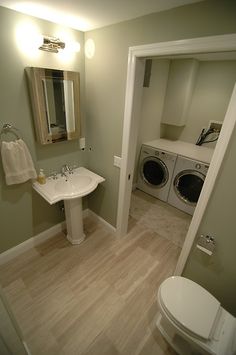 a washer and dryer in a small bathroom