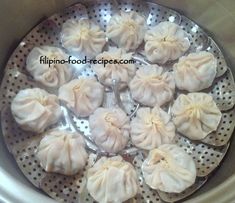 some dumplings are sitting on a metal plate in the crock pot and ready to be cooked