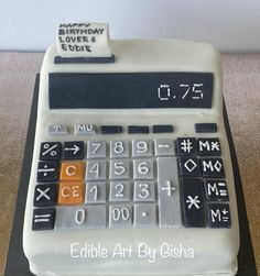 a birthday cake with a calculator on it