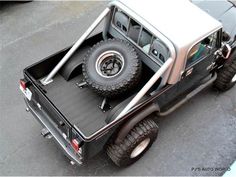 an off - road vehicle is parked in a parking lot