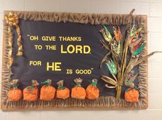 a bulletin board with pumpkins on it that says, oh give thanks to the lord for he is good