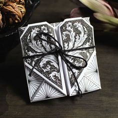 an origami box with black and white designs on it