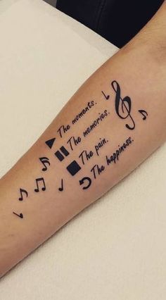 a person's arm with musical notes on it and the words in different languages