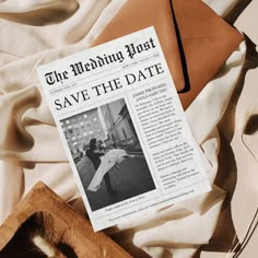 the wedding must save the date newspaper next to an envelope