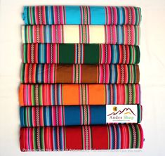 a stack of multicolored cloths sitting on top of each other