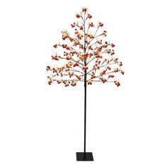 a tall metal tree with red and white flowers on it's branches, against a white background