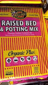 a bag of organic plus raised bed and potting mix