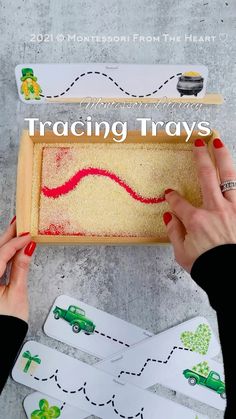 two hands are holding a tray with playing cards in it and the words tracing trays