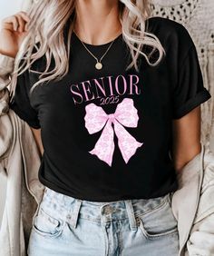 Senior 2025 Coquette Shirt, Graduation Gift, Pink Bow Shirt, Back to School Shirt, Senior Gift, Graduate 2025Shirt, High School Senior Gift Welcome to For, All Day, where you can find stylish, modern, cute and extremely comfortable t-shirts specially designed for everyone. - HOW TO PLACE YOUR ORDER - 1. Choose your t-shirt color 2. Choose your size 3. Choose your design&text color 4. PLEASE make sure all your order's steps - 100% Airlume combed and ringspun cotton (fiber content may vary for dif Casual Letter Print Shirt For Graduation, Casual Short Sleeve Tops For Graduation, Casual Long Sleeve Tops For Graduation, High School Senior Gifts, Coquette Shirt, Bow Shirt, Senior Gifts, Bow Shirts, Design Text